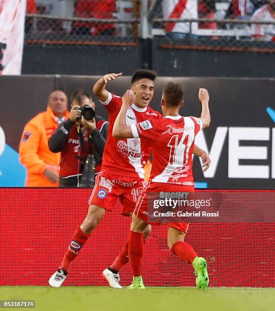 Nicolas Gonzalez of Argentinos Juniors celebrates with teammate Braian Romero after scoring the first goal of his team during a match between River...