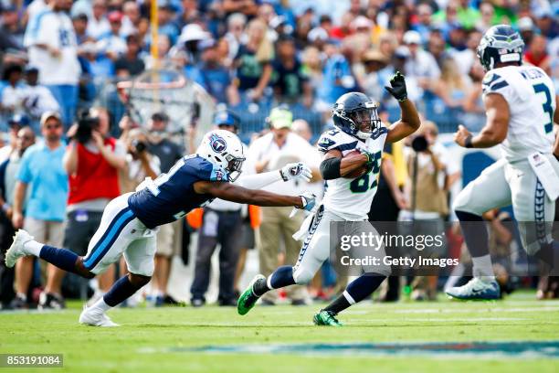 Wide Receiver Doug Baldwin of the Seattle Seahawks runs the ball against Safety Kevin Byard of the Tennesee Titans at Nissan Stadium on September 24,...