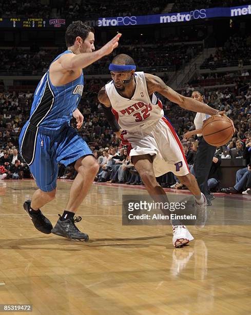 Richard Hamilton of the Detroit Pistons drives around J.J. Redick of the Orlando Magic in a game at the Palace of Auburn Hills on March 9, 2009 in...