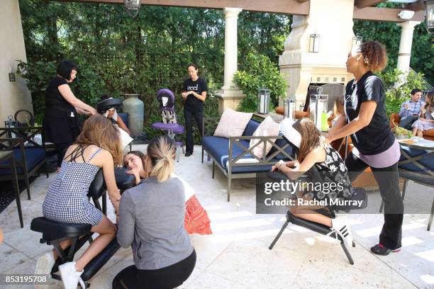 Guests get massages during the Positively Social launch event on September 24, 2017 in Beverly Hills, California.