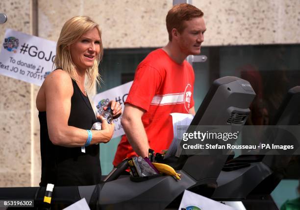 Radio 2 presenter Jo Whiley, with Greg Rutherford, as Whiley is taking part in the Sport Relief Challenge on a treadmill, in a perspex box, outside...