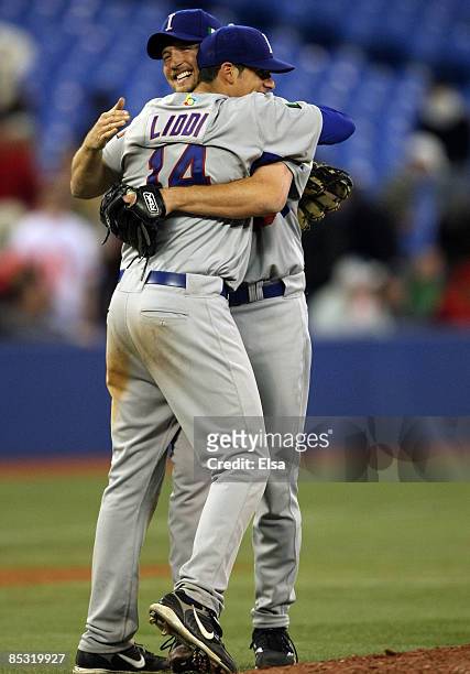 Jason Grilli and Alex Liddi of Italy celebrate a win over Canada during the 2009 World Baseball Classic Pool C game on March 9, 2009 at the Rogers...