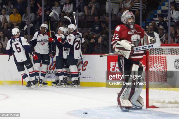 Forward Aaron Luchuk of the Windsor Spitfires celebrates his second period goal against goaltender Anthony Popovich the Guelph Storm on September 24,...