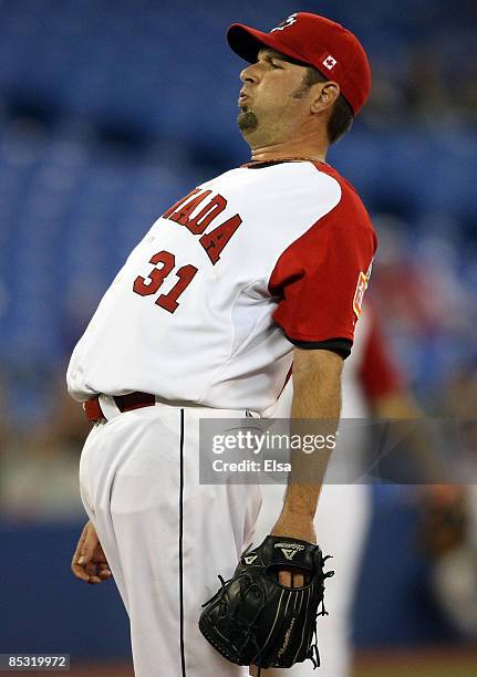 Steve Green of Canada reacts after walking a batter during the 2009 World Baseball Classic Pool C game on March 9, 2009 at the Rogers Centre in...