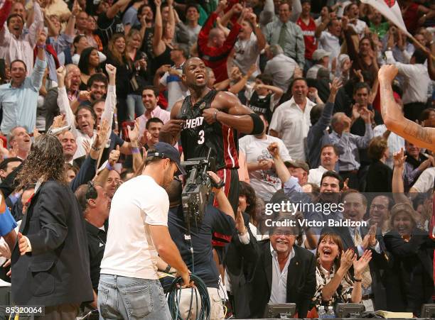 Dwyane Wade of the Miami Heat celebrates a victory over the Chicago Bulls on March 9, 2009 at the American Airlines Arena in Miami, Florida. NOTE TO...