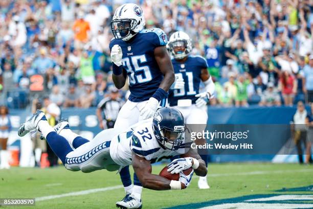 Running Back Chris Carson of the Seattle Seahawks runs the ball to score against the Tennessee Titans at Nissan Stadium on September 24, 2017 in...