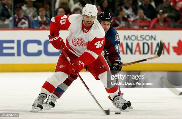 Henrik Zetterberg of the Detroit Red Wings controls the puck against the Colorado Avalanche during NHL action at the Pepsi Center on March 4, 2009 in...