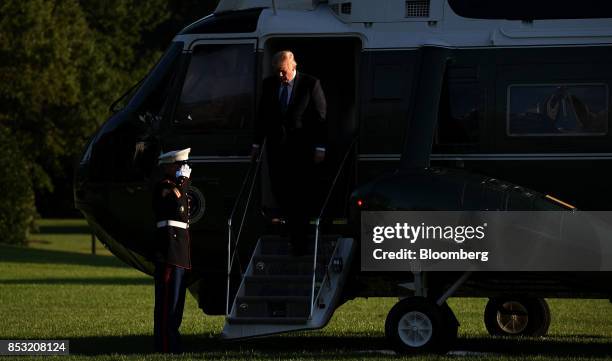 President Donald Trump disembarks Marine One on the South Lawn after returning to the White House in Washington, D.C., U.S., on Saturday, Sept. 24,...