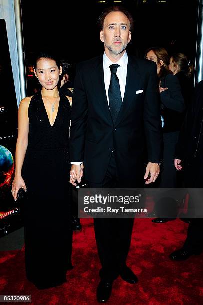 Actor Nicolas Cage and Alice Kim attend the premiere of "Knowing" at the AMC Loews Lincoln Square on March 9, 2009 in New York City.