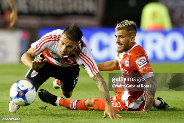 Carlos Auzqui of River Plate fights for the ball with Gonzalo Piovi of Argentinos Juniors during a match between River Plate and Argentinos Juniors...