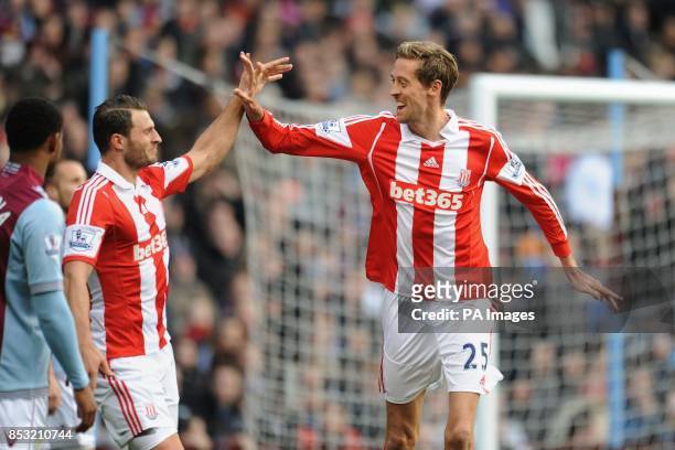 Stoke City's Peter Crouch celebrates with Erik Pieters after scoring his teams second goal during the Barclays Premier League match at Villa Park,...