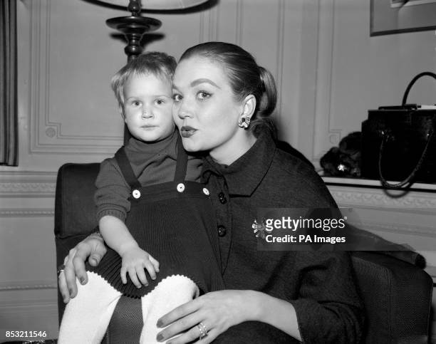 Hollywood actress Patrice Wymore, wife of actor Errol Flynn, pictured with her two-year-old daughter, Arnella, the Savoy Hotel, London. Wymore...