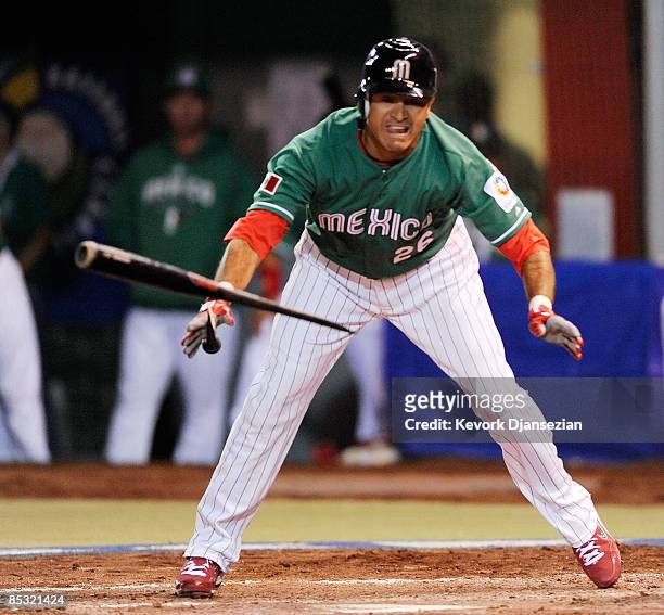 Oscar Robles of Mexico breaks his bat during play against South Africa during the 2009 World Baseball Classic Pool B match on March 9, 2009 at the...
