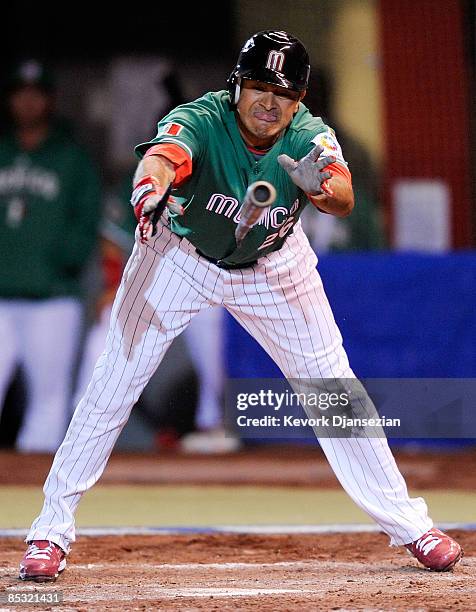 Oscar Robles of Mexico breaks his bat during play against South Africa during the 2009 World Baseball Classic Pool B match on March 9, 2009 at the...