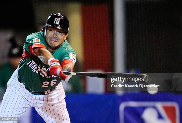 Oscar Robles of Mexico breaks his bat during play against South Africa during the 2009 World Baseball Classic Pool B match on March 9, 2009 at the...