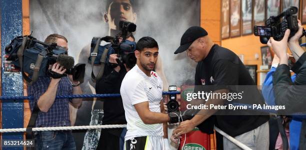 Amir Khan and trainer Virgil Hunter during the media workout at the Gloves Community Centre, Bolton.