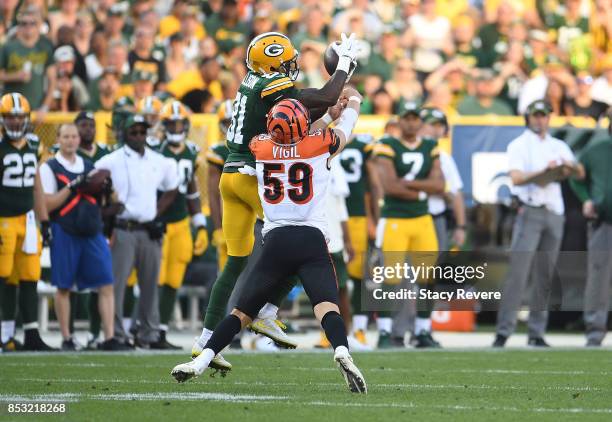 Geronimo Allison of the Green Bay Packers catches a pass during the third quarter against the Cincinnati Bengals at Lambeau Field on September 24,...