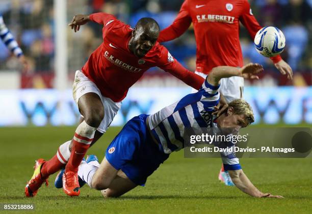 Reading's Pavel Pogrebnyak is challenged by Barnsley's Jean Yves M'Voto during the Sky Bet Championship match at the Madejski Stadium, Reading.