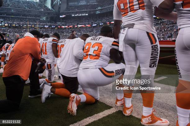Cleveland Browns players kneel and lock arms during the national anthem before the NFL game between the Cleveland Browns and Indianapolis Colts on...