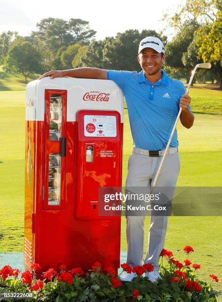 Xander Schauffele of the United States celebrates with the Calamity Jane trophy on the 18th green after winning during the final round of the TOUR...