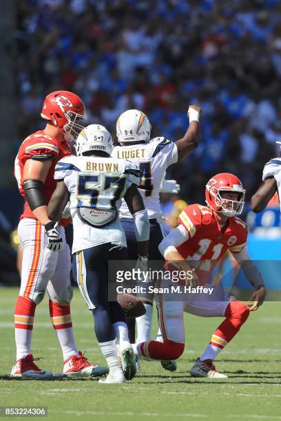 Alex Smith of the Kansas City Chiefs gets sacked by Joey Bosa of the Los Angeles Chargers and Corey Liuget of the Los Angeles Chargers during the...