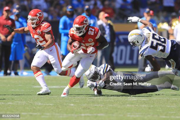 Kareem Hunt of the Kansas City Chiefs avoids the tackle against Jatavis Brown of the Los Angeles Chargersduring the game against the Los Angeles...