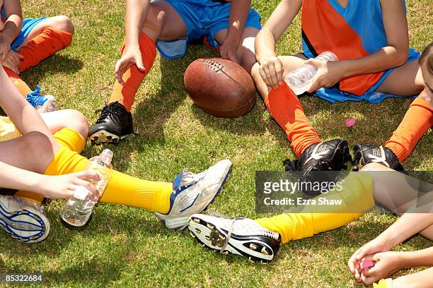 group of players having a break, chatting - australian rules football ball stock pictures, royalty-free photos & images