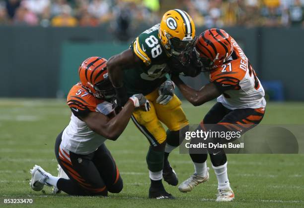 Ty Montgomery of the Green Bay Packers carries the ball during the fourth quarter against the Cincinnati Bengals at Lambeau Field on September 24,...