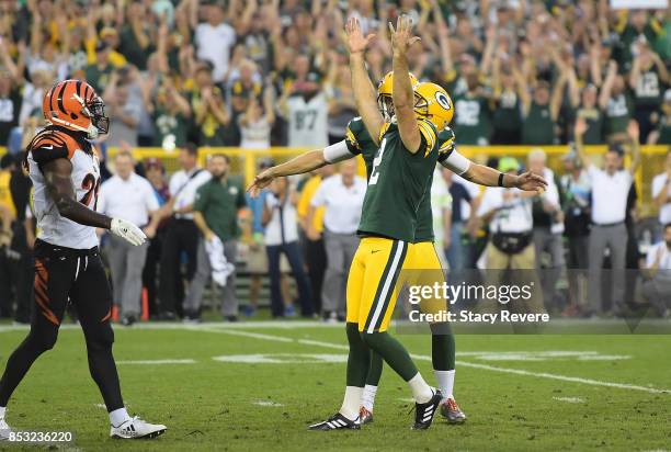 Mason Crosby of the Green Bay Packers celebrates after kicking the game-winning field goal to defeat the Cincinnati Bengals in overtime at Lambeau...