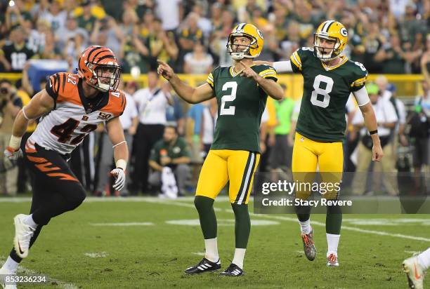 Mason Crosby of the Green Bay Packers celebrates after kicking the game-winning field goal to defeat the Cincinnati Bengals in overtime at Lambeau...