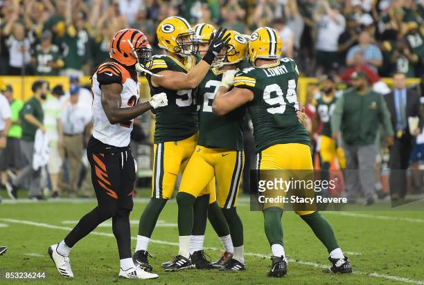 Mason Crosby of the Green Bay Packers celebrates after kicking the game-winning field goal to defeat the Cincinnati Bengals in overtime at Lambeau...