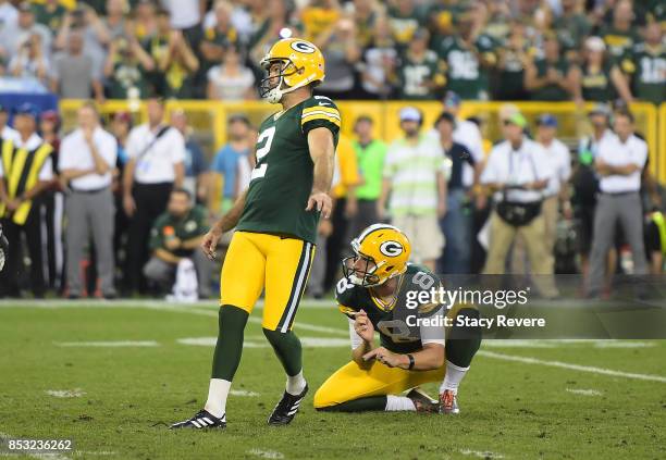 Mason Crosby of the Green Bay Packers kicks the game-winning field goal to defeat the Cincinnati Bengals in overtime at Lambeau Field on September...