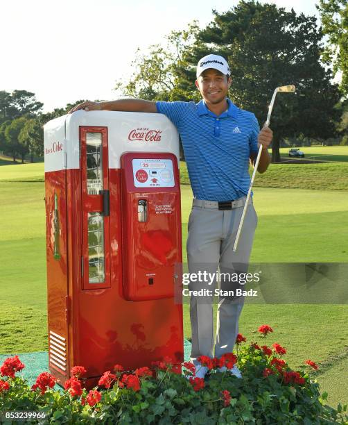Xander Schauffele of the United States celebrates with the Calamity Jane trophy on the 18th green after winning the final round of the TOUR...