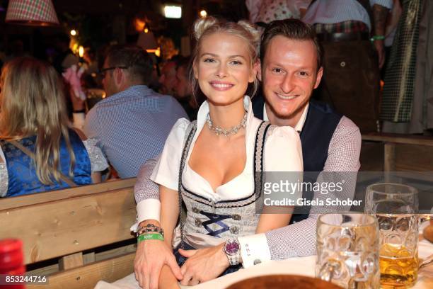 Darya Strelnikova and her boyfriend Roger Steininger during the Oktoberfest at Kaefer tent Theresienwiese on September 24, 2017 in Munich, Germany.