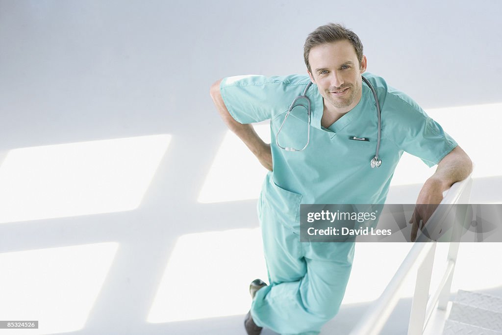 Male surgeon, smiling, portrait, overhead view