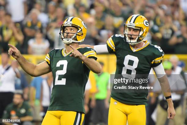Mason Crosby of the Green Bay Packers celebrates after kicking the game winning field goal in overtime against the Cincinnati Bengals at Lambeau...