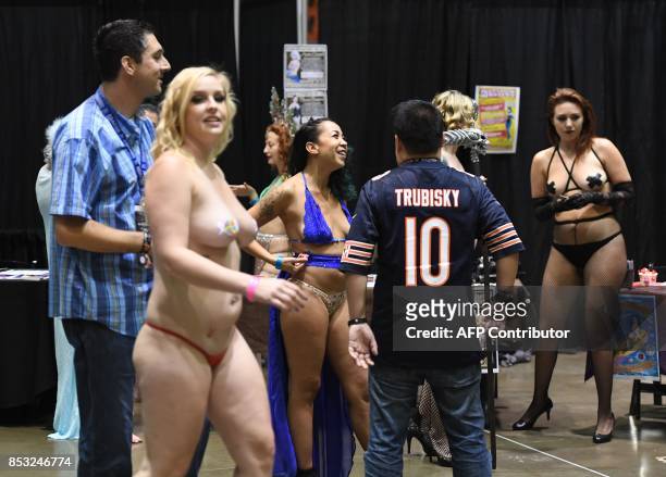Graphic content / Performers meet with fans during the annual 'AdultCon' - Adult Entertainment Convention in Los Angeles, California on September 24,...