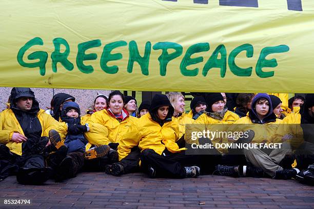 Greenpeace environmental activists block the entrance of the European council during an Economy and Finance Council meeting of EU finance ministers...