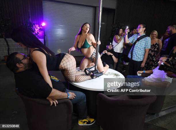 Graphic content / Performers meet with fans during the annual 'AdultCon' - Adult Entertainment Convention in Los Angeles, California on September 24,...