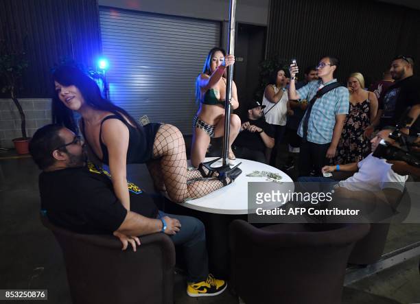 Graphic content / Performers meet with fans during the annual 'AdultCon' - Adult Entertainment Convention in Los Angeles, California on September 24,...