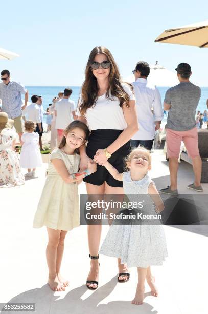 Rochelle Gores Fredston and children attend Maisonette Beach BBQ on September 24, 2017 in Malibu, California.