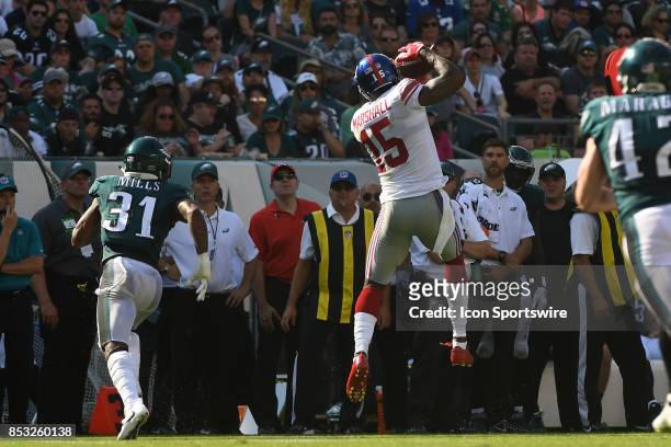 New York Giants wide receiver Brandon Marshall makes a leaping reception during a NFL football game between the New York Giants and the Philadelphia...