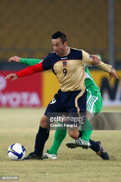 Sasho Petrovski of Australia's Newcastle Jets fights the ball with Darko Matic of China's Beijing Guoan during the AFC Champions League Group E match...