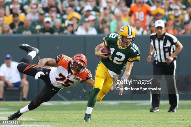 Cincinnati Bengals defensive end Jordan Willis gets a hand on Green Bay Packers quarterback Aaron Rodgers during a game between the Green Bay Packers...