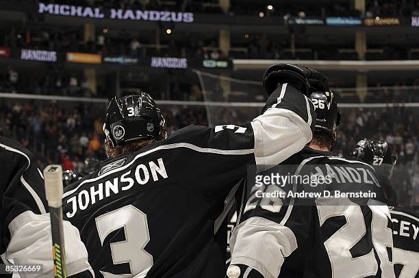 Michal Handzus of the Los Angeles Kings is congratulated by teammate Jack Johnson after making a hat trick game winning shot against the Dallas Stars...