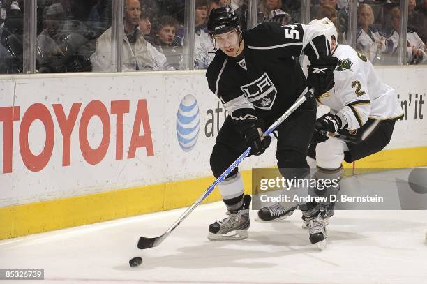 Niklas Grossman of the Dallas Stars defends from behind against Teddy Purcell of the Los Angeles Kings during the game on March 5, 2009 at Staples...