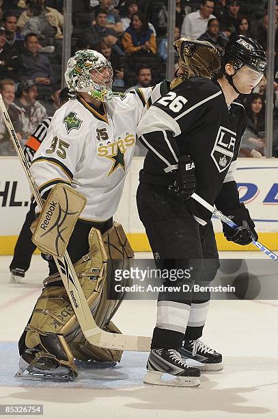 Marty Turco of the Dallas Stars hits Michal Handzus of the Los Angeles Kings in the back of the head during the game on March 5, 2009 at Staples...