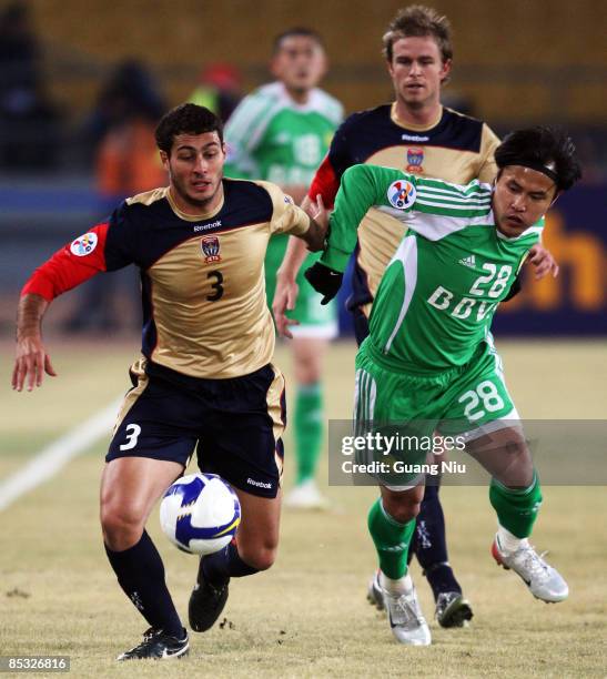 Adam Leonard D'Apuzzo of Newcastle Jets and Guo Hui of Beijing Guoan fight for a ball during the AFC Champions League Group E match between Beijing...