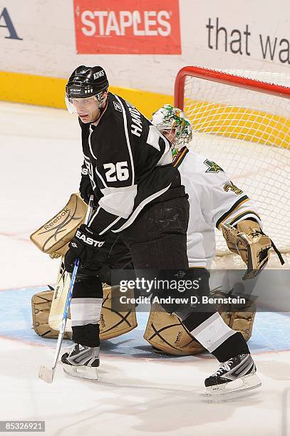 Marty Turco of the Dallas Stars dfends in the crease against Michal Handzus of the Los Angeles Kings during the game on March 5, 2009 at Staples...