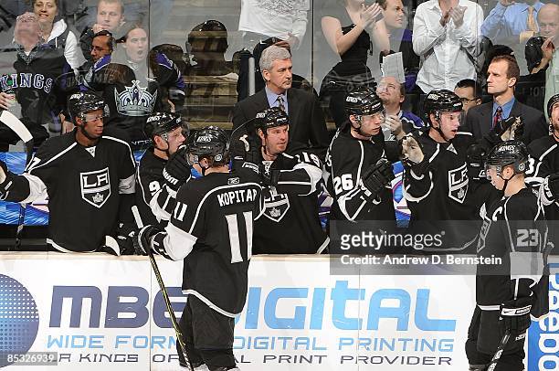 Anze Kopitar and Dustin Brown of the Los Angeles Kings celebrate with their teammates a second period goal against the Dallas Stars during the game...